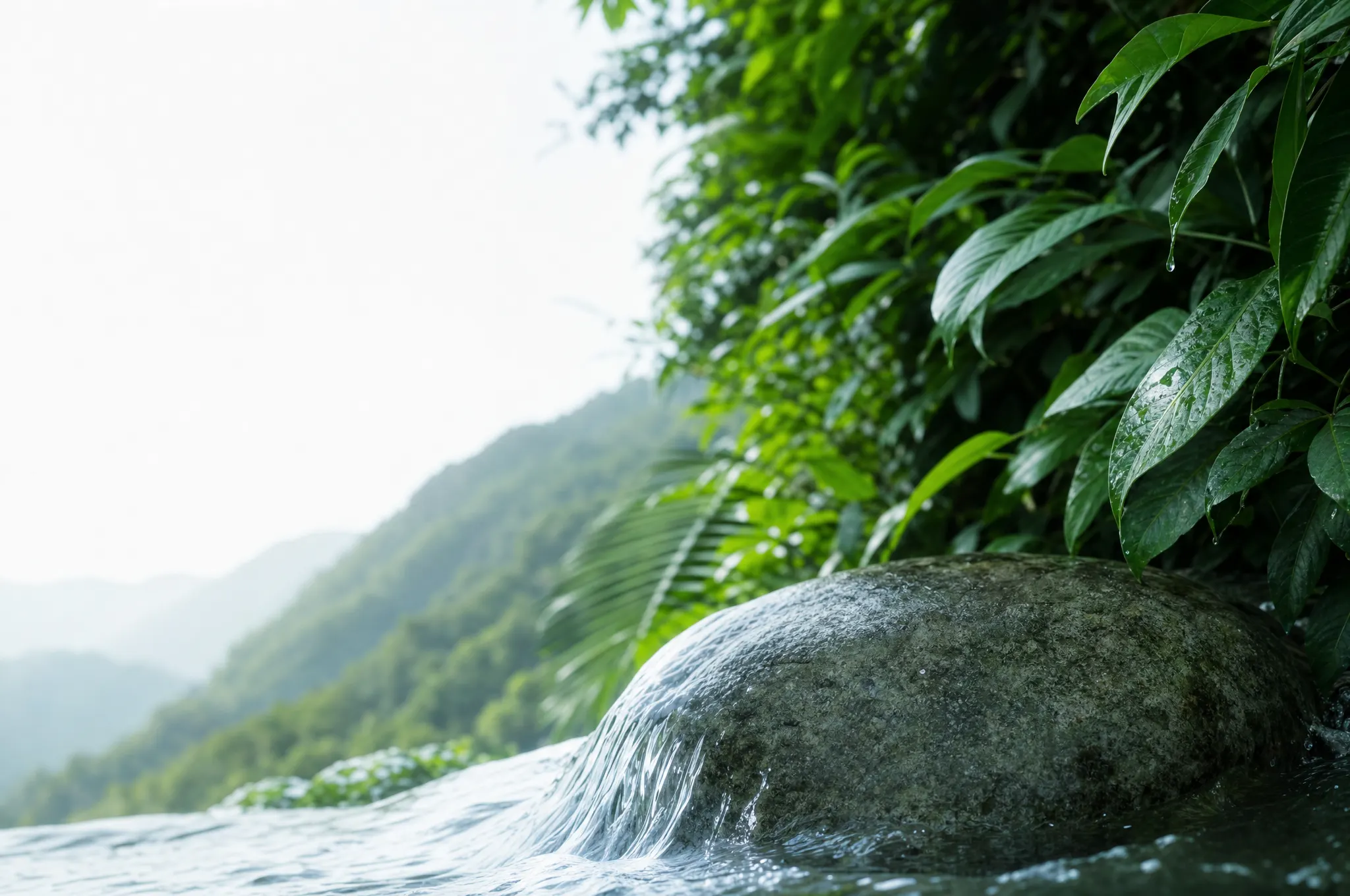 Clear natural water moving over pale mineral stone